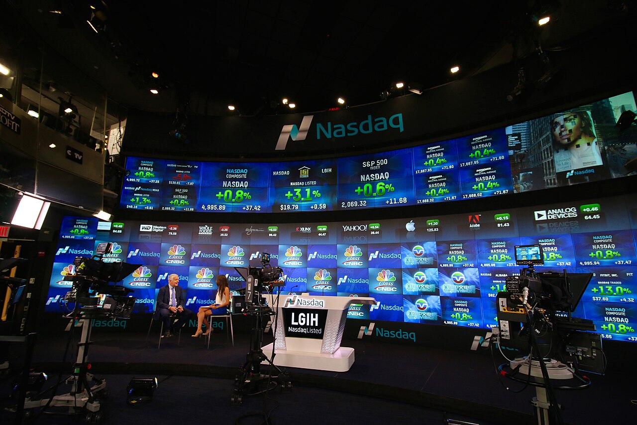 The Nasdaq MarketSite studio in New York, its curved video wall showing stock tickers.